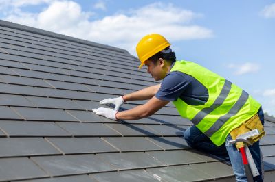 Roofers working on a pitched roof
